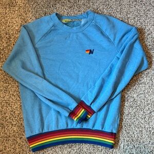 Aviator Nation Light Blue Crewneck with Rainbow Stripe Cuffs & Hem